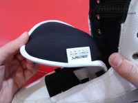 There are 3 holes for the laces at the top